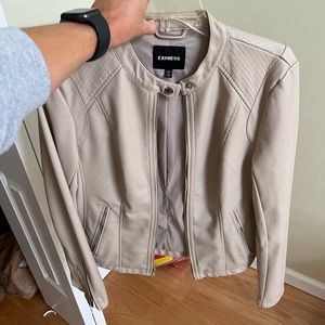 Express sized medium tan leather jacket. Zip up. In perfect condition.